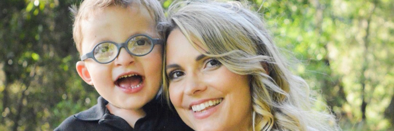 Finding Meaningful Relationships for Children With Disabilities the author and her son smiling, sitting outside