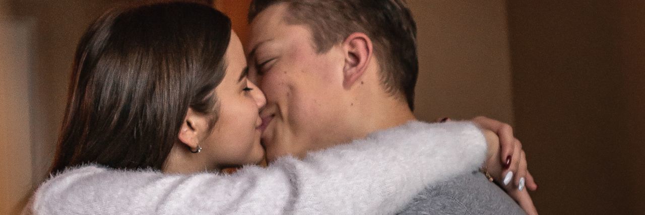 How to Stop Getting Sick When Dating With Celiac Disease photo of young man and woman kissing on bed