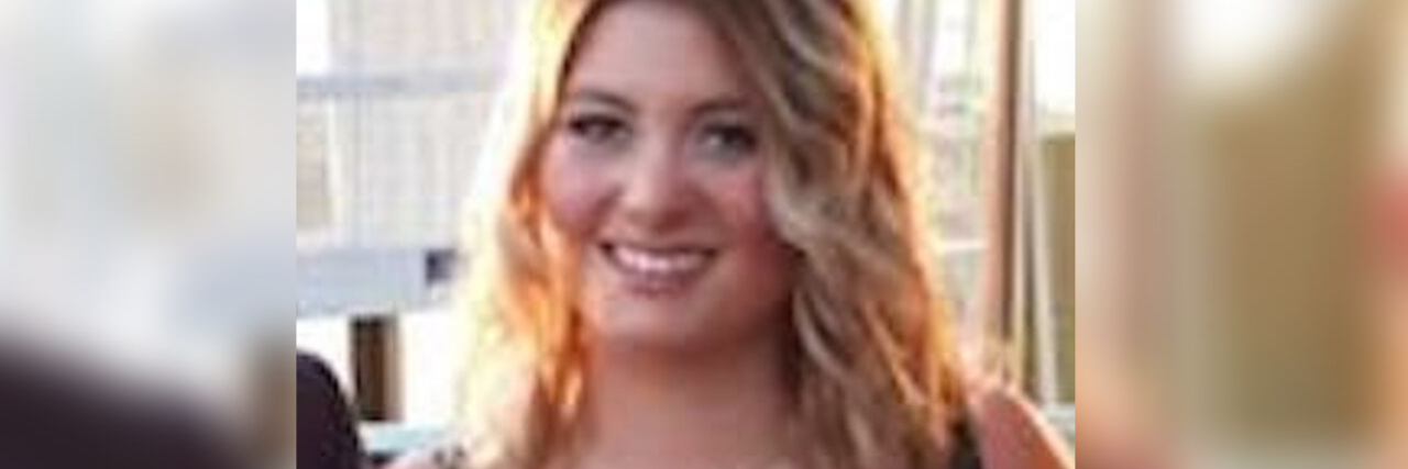 Accepting My Dyspraxia Diagnosis Georgia Peach dressed elegantly and holding a drink.