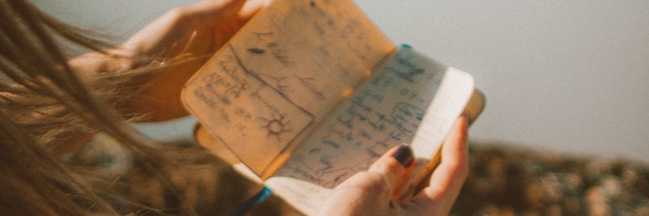 A Goodbye Letter to My Borderline Personality Disorder A woman looking at a note book