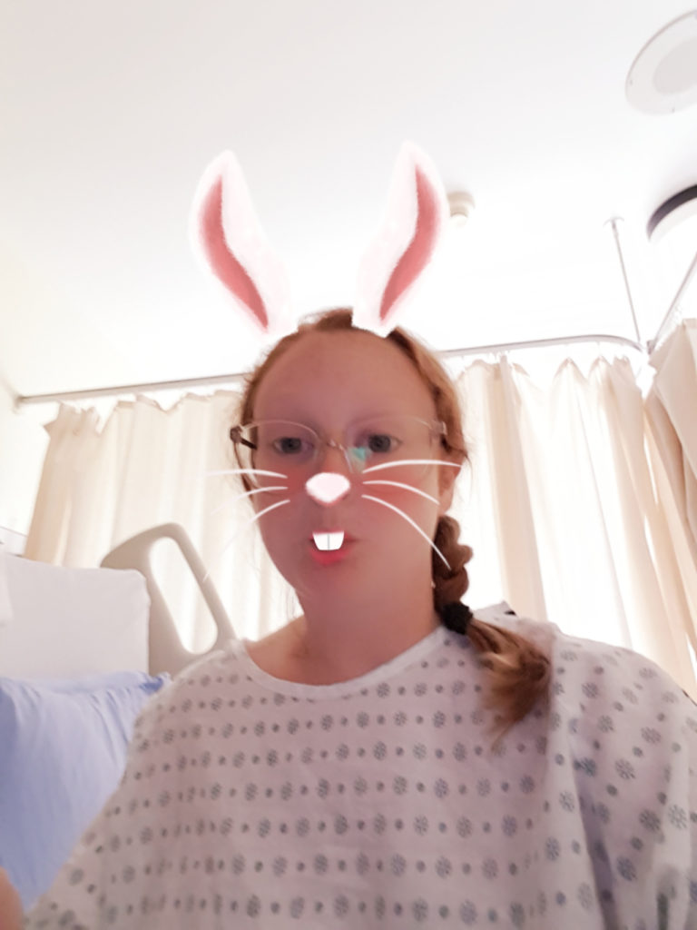 photo of contributor wearing hospital gown with bunny ear filter