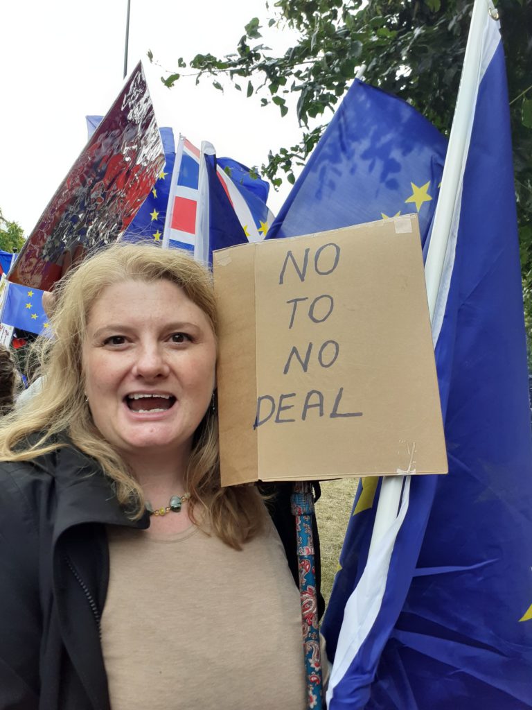 photo of woman at Brexit protest holding sign which says "no to no deal"