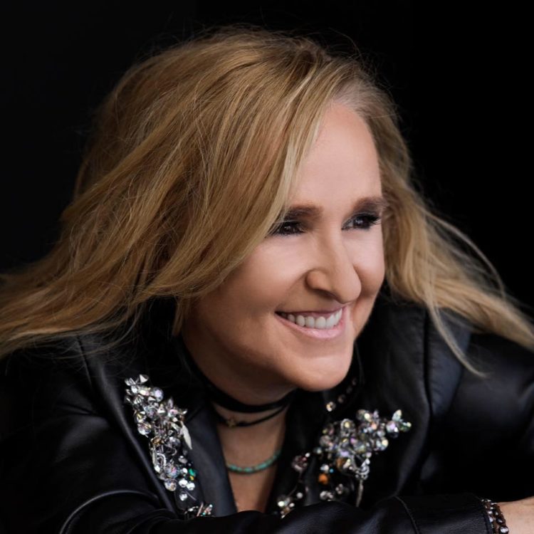 Melissa Etheridge smiling wearing a black shirt