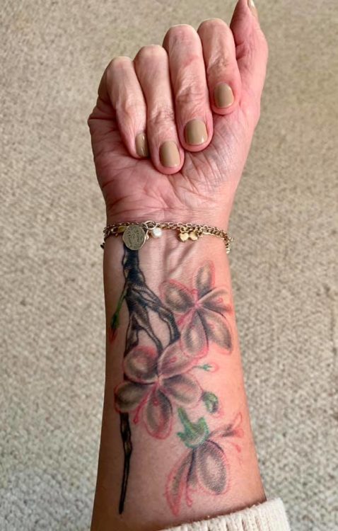 cherry blossom tree branches on arm