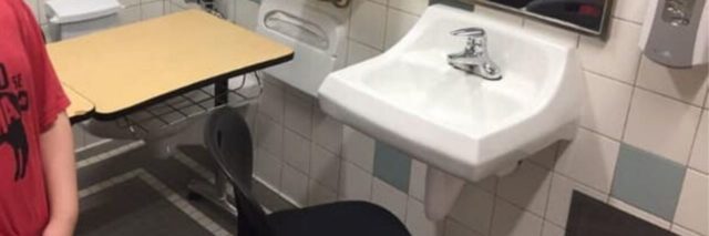 Autistic student Lucas Goodwin's desk and chair in a bathroom