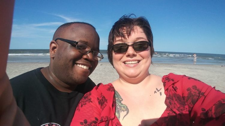 Couple smiling selfie on the beach