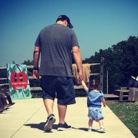 Kelly's daughter walking with her father.