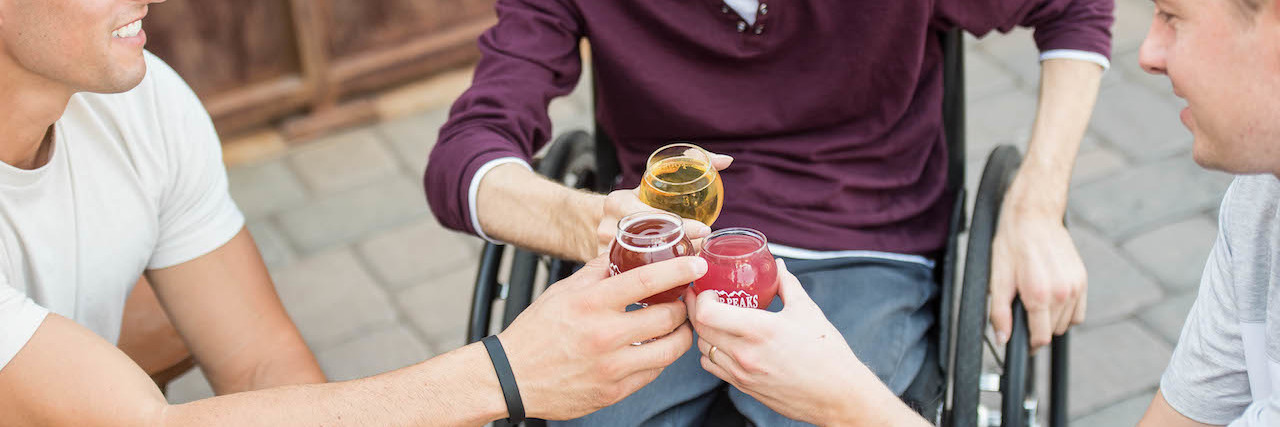 Brewers Collective Launches Disability-Inclusive Beer Stock Images Three men clinking beer glasses