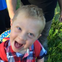 Beth's son making a goofy happy face.