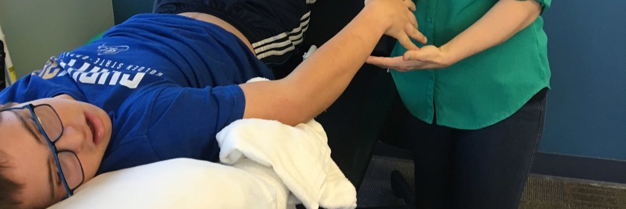 Modifying Lessons for Children With Intellectual Disabilities George at his physical therapy session.