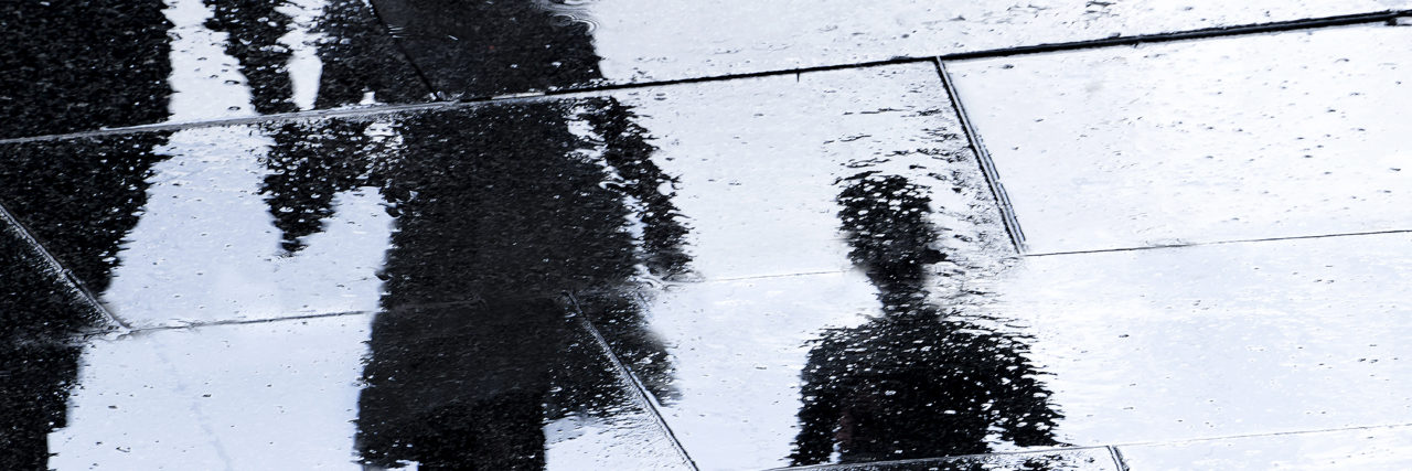 To the Parents Who Feel Guilty for 'Missing' Their Child's Genetic Disease Blurry reflection of two children holding their parents hand