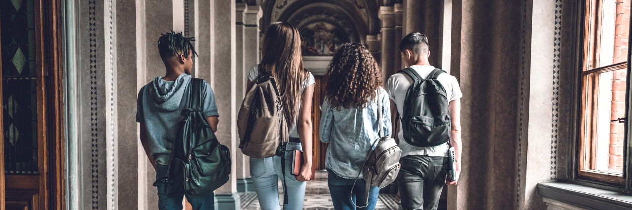 3 Tips for Students With Chronic Illness College students walking in a hallway and chatting.