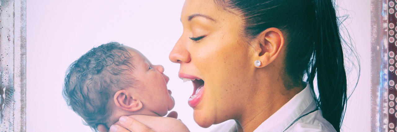 African-American mother holding her baby.