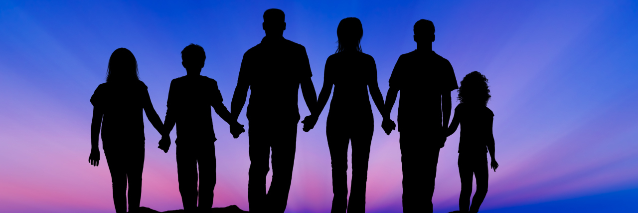 Mitochondrial Disease Awareness Week: Multigenerational Disease Silhouette of a family at sunset; everyone holding hands