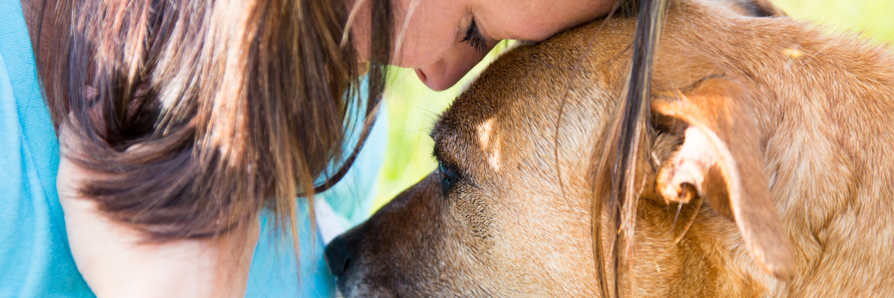 When You Lose That Person a woman is being consoled by a dog