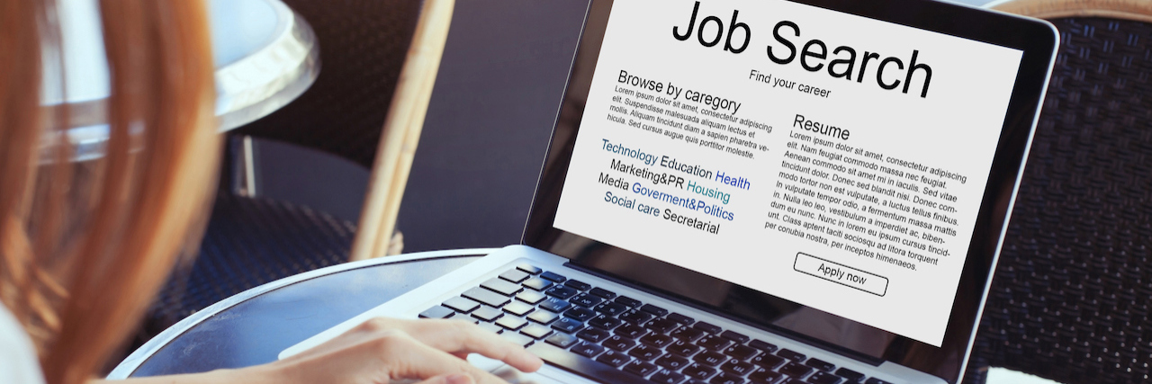 Advice for Finding a Job With Chronic Illness Red-haired woman holding coffee cup with hand on open laptop that reads, "Job search."