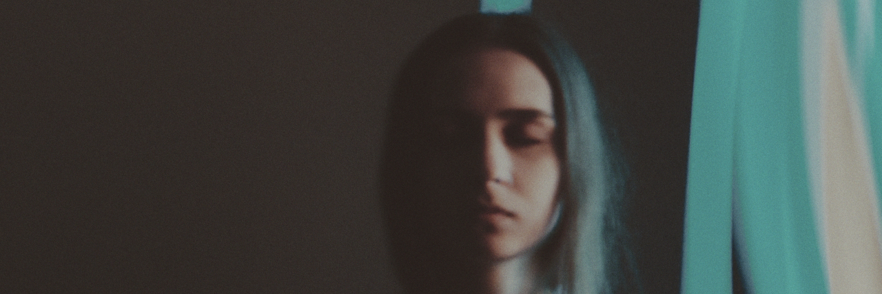 Coping With Sensory Issues as a Person on the Autism Spectrum Young woman with blue lines flowing behind her.