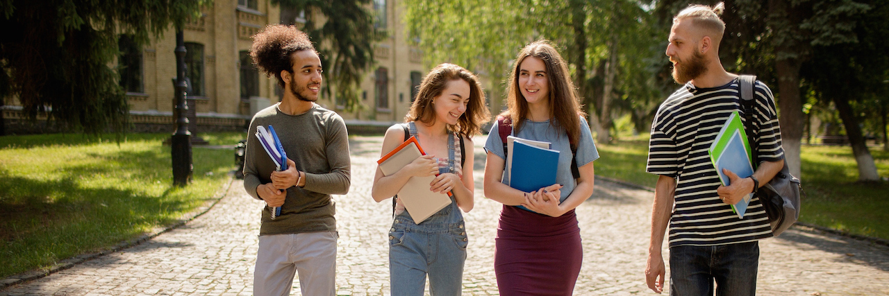 What I Really Learned at College as Someone on the Autism Spectrum Diverse group of college students walking on campus
