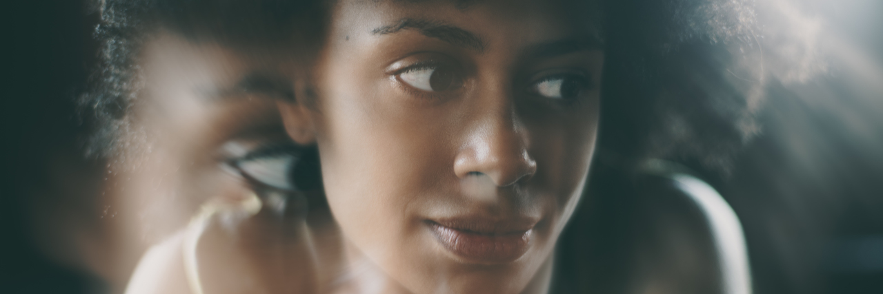 When I Question My Worth as Someone With Chronic Illness African-American woman looking thoughtful.