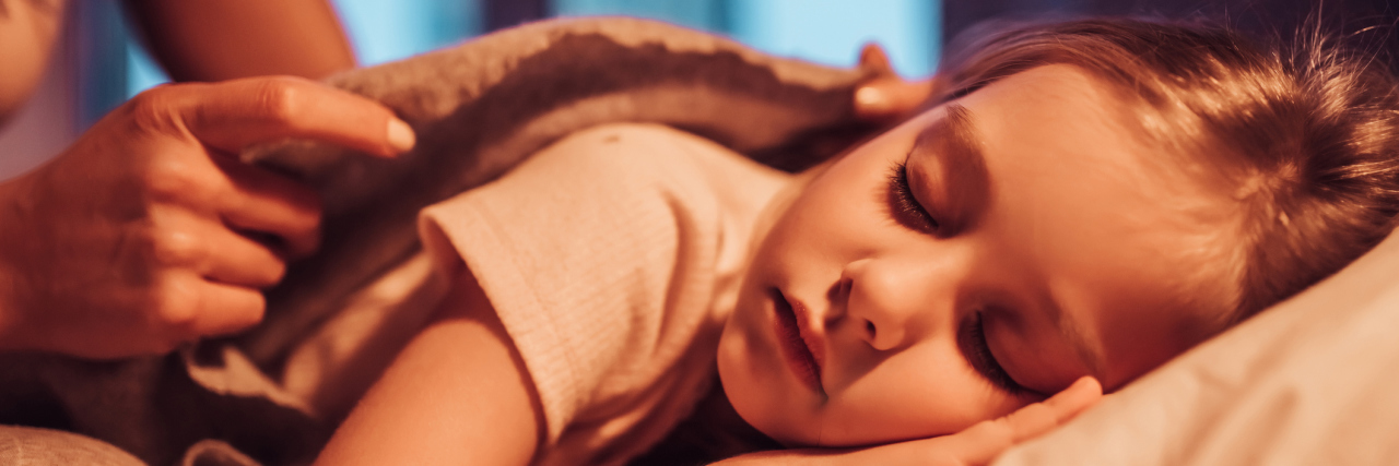 6 Things Every Parent Should Know About SUDEP young woman with little cute girl are spending time together at home. Mom is putting daughter to bed.