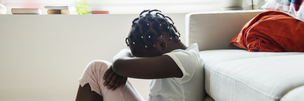 Meltdowns and Tantrums Are Not the Same Girl sitting on the floor crying.