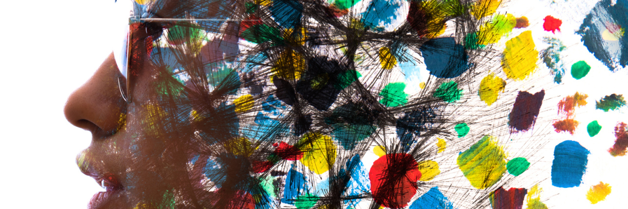 Stop Using the Word 'Issues' to Describe Mental Illness An abstract profile of a woman with colorful paint imagery.