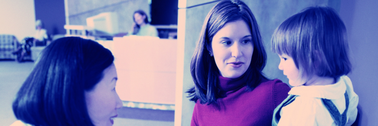 What It Means to Be the Mother of a Medically Complex Child pediatrician talking to a mother and her child in a waiting room