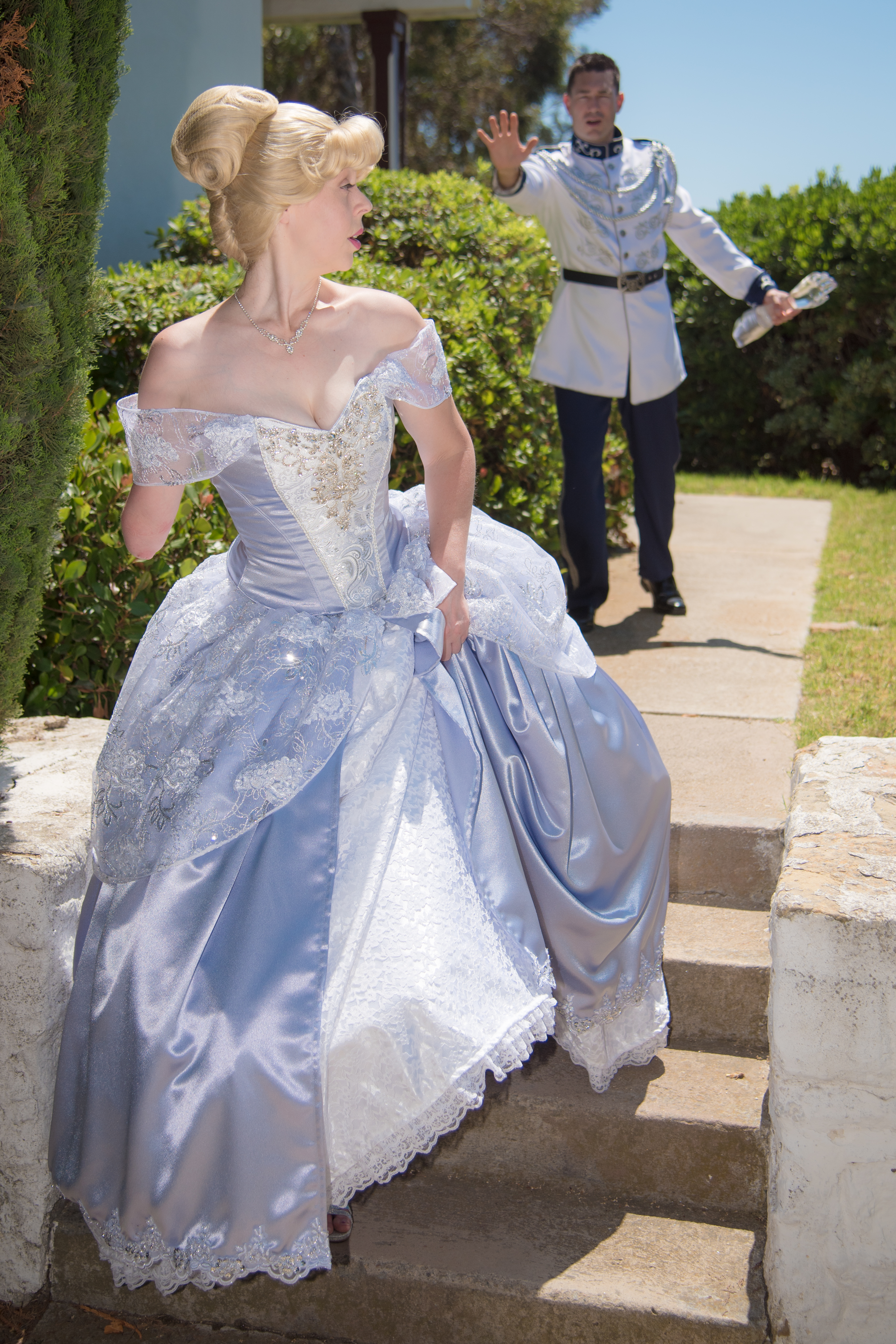 Mandy Pursley as Cinderella while Prince Charming chases her with missing glass arm