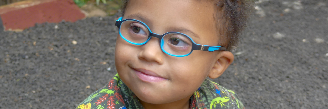 Explaining Your Child's Disability to Their Classmates Hayley's son wearing blue glasses.