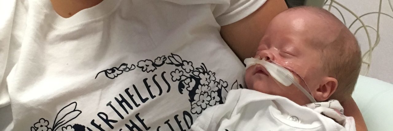 Raising Awareness for Hydrocephalus Awareness Month in September Mari being held by her mother in the hospital