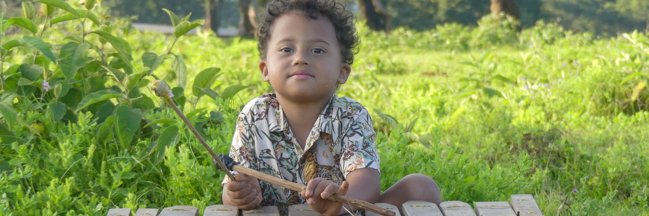 Accepting Children With Down Syndrome for Who They Are Hayley's son with Down syndrome playing outside.