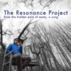 A man wearing a neck brace sitting in the forest. Text reads "The Resonance Project. From the pain of many, a song."