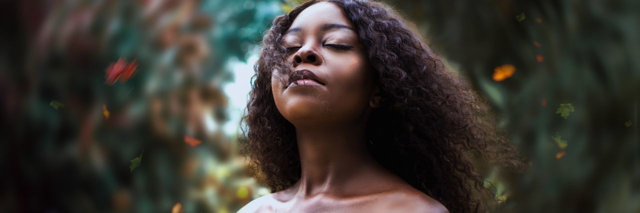 When You're 'High-Functioning' but Constantly Suicidal A woman standing outside, closing her eyes and looking up