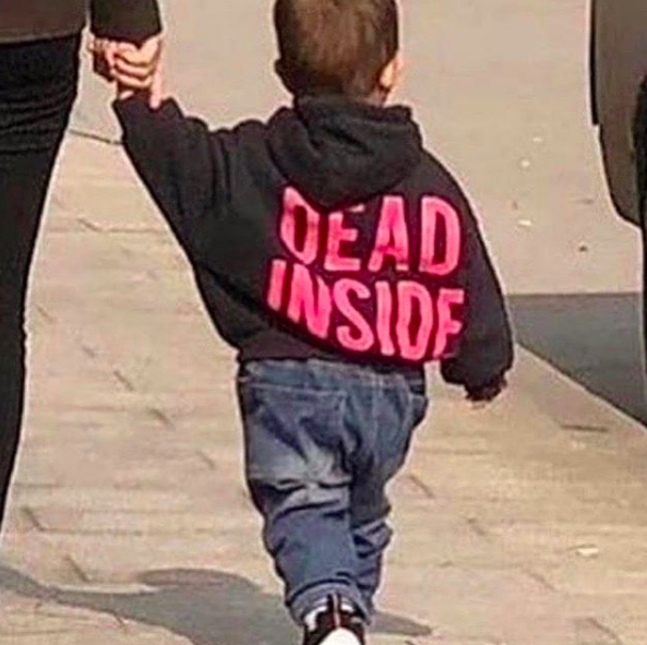 baby wearing jacket that says "dead inside"