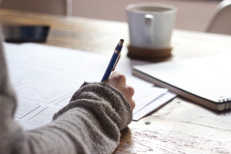 woman writing a list