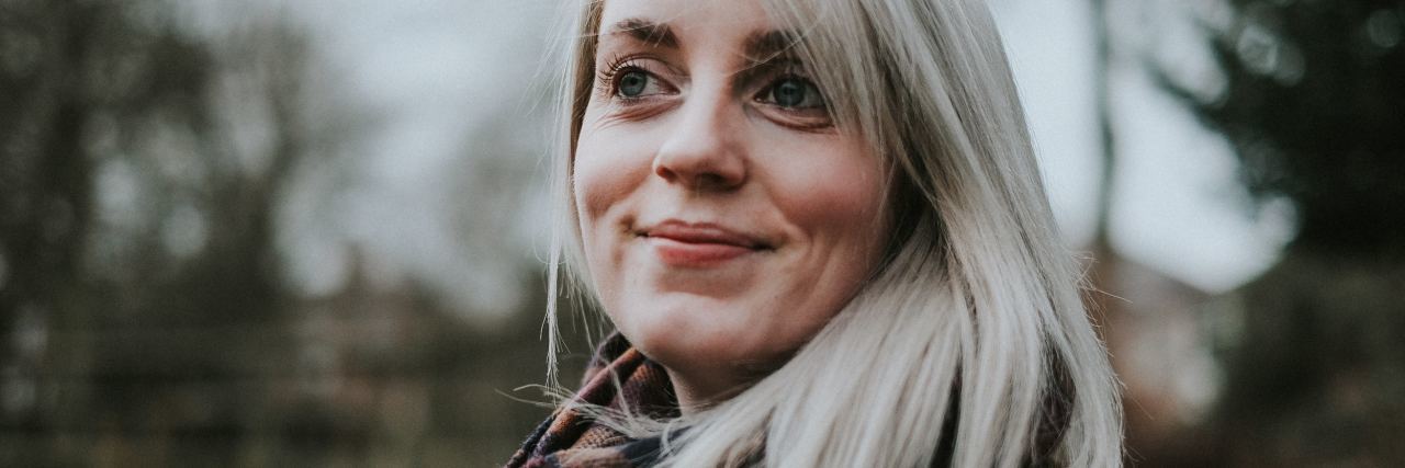 What to Know When Starting Mental Illness Recovery photo of blonde woman smiling and looking off camera
