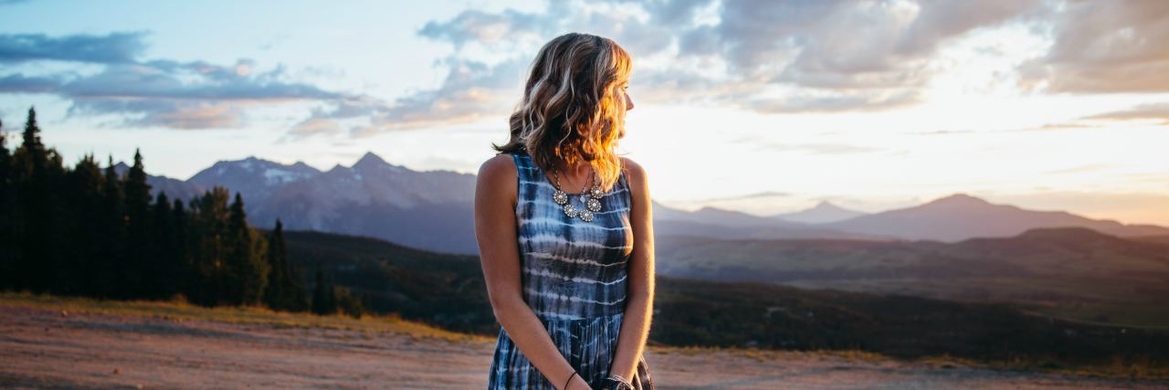 Using Cloud Types to Explain Depression and Suicidal Thoughts photo of woman looking at clouds in sky at sunset