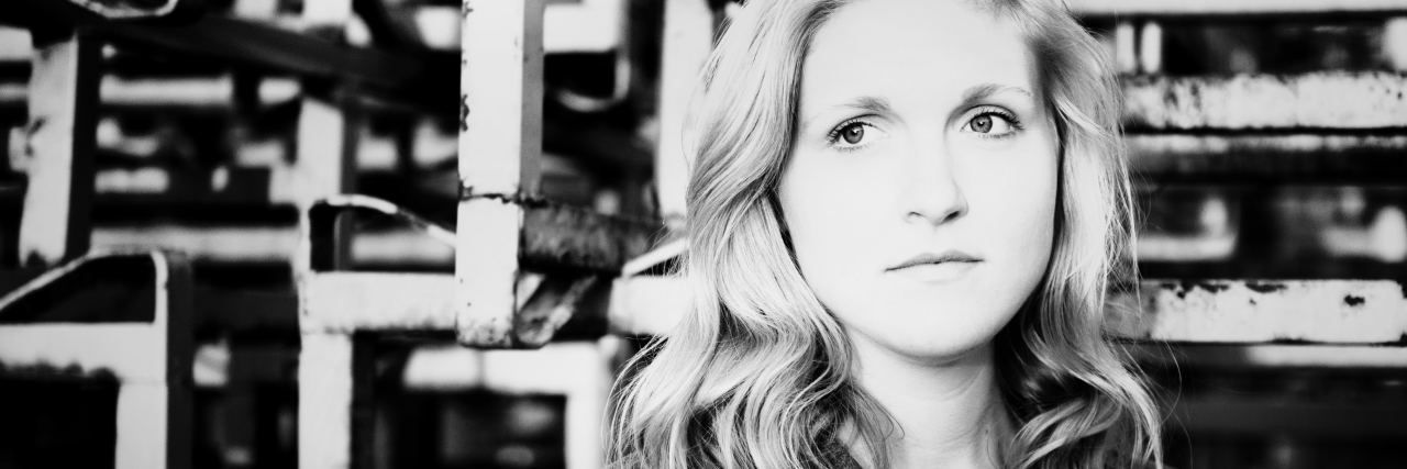 What I'd Like You to Know About Living With Schizophrenia black and white photo of woman posing for camera looking away