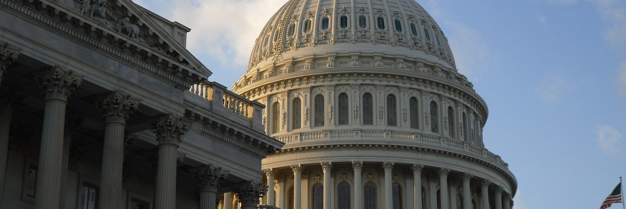 Congress Passes and Expands, Trump Signs Autism CARES Act Support Side angle of the U.S. Capitol building