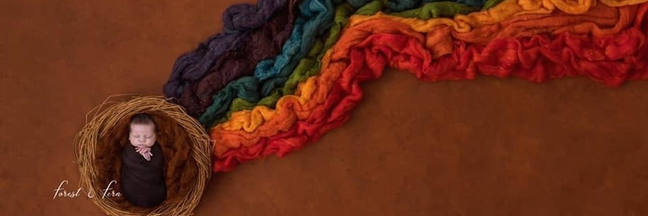 Please Don't Assume Our Rainbow Baby Erases My Grief a newborn rainbow baby