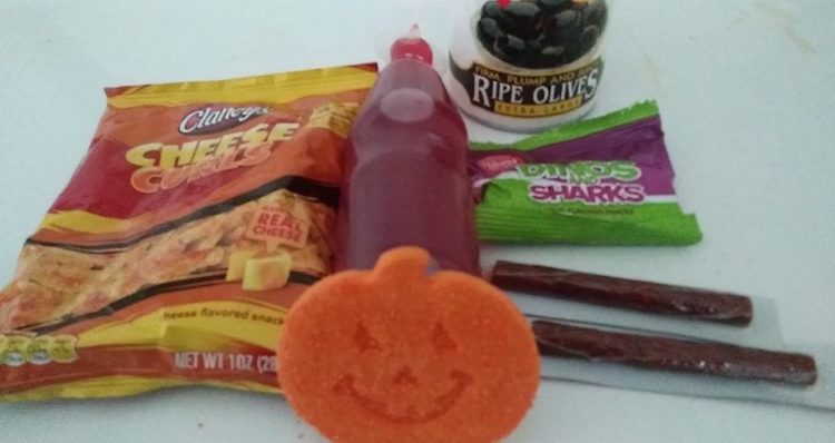 “Chips ... Black olives ... Juice... Beef jerky sticks ... Gummies ... And a pumpkin cookie.” — Amber A.