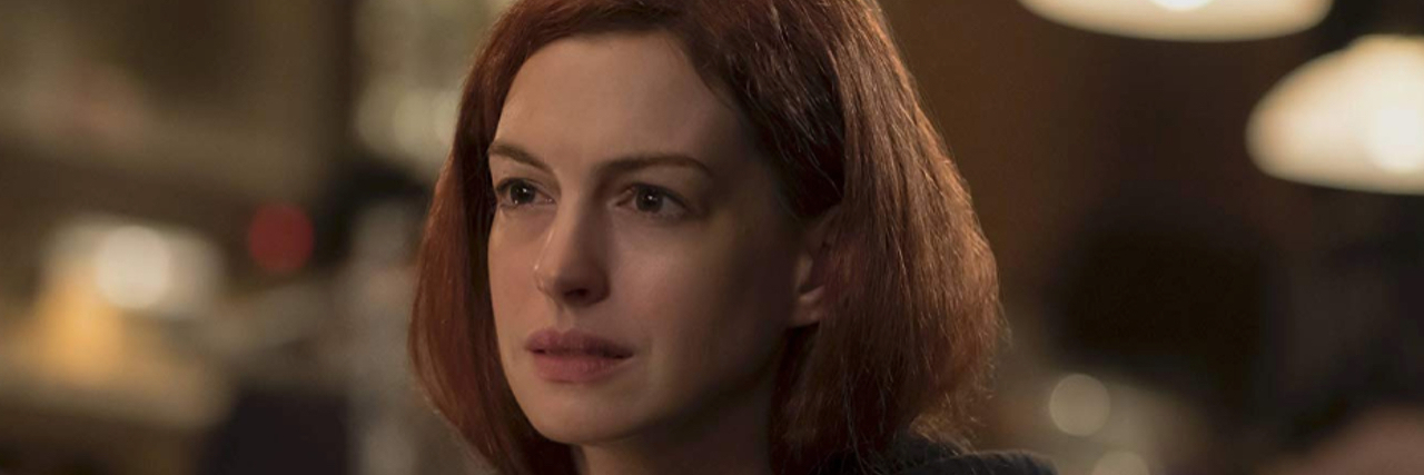 Image of actress Anne Hathaway looking upset.