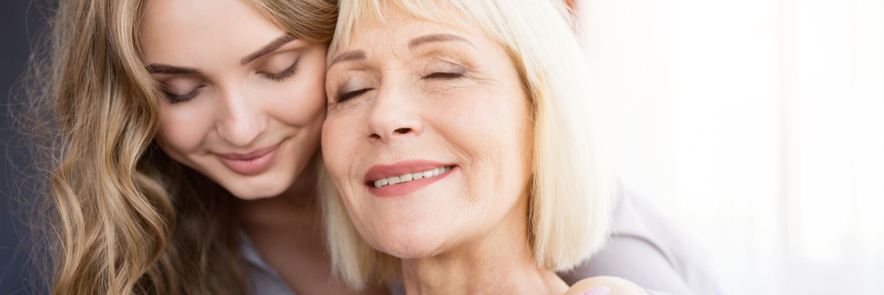 What Not to Say to Someone With Parkinson's Disease A woman and her daughter embracing