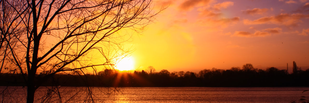 Learning Gratefulness After Becoming Disabled Sunset over a lake.