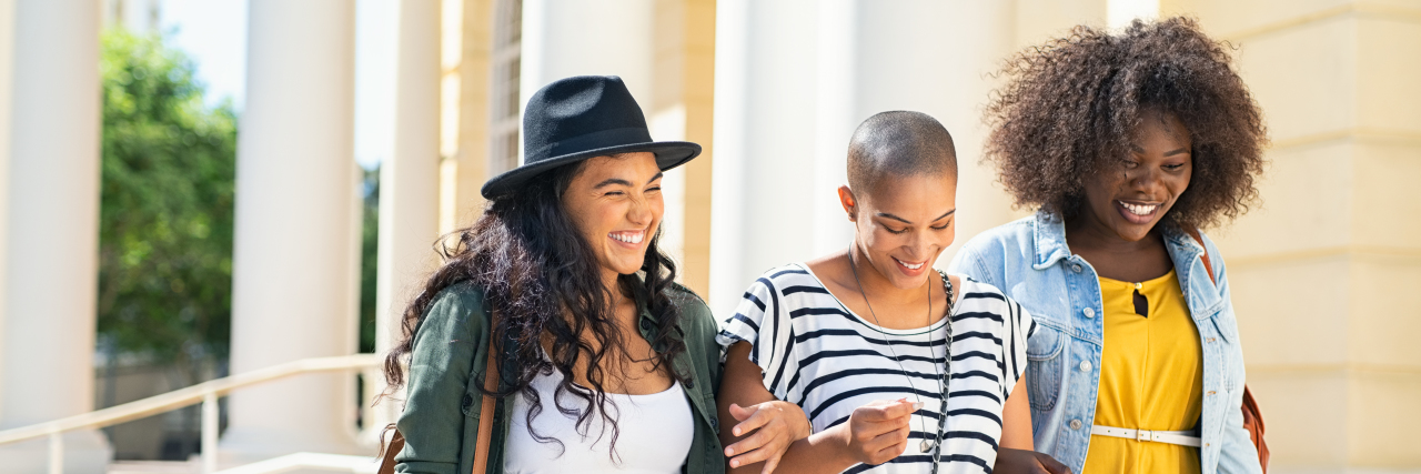 5 Dos and Don'ts for Supporting Someone With Chronic Illness Group of three friends walking together.