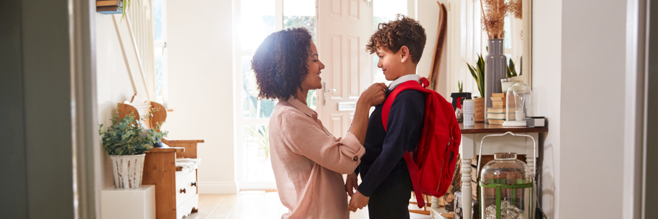 When Kids Ask or Comment About People With Disabilities Mother getting her son ready for school.