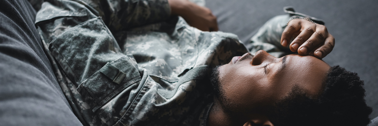 5 Questions Not to Ask a Veteran A man sitting in his army uniform