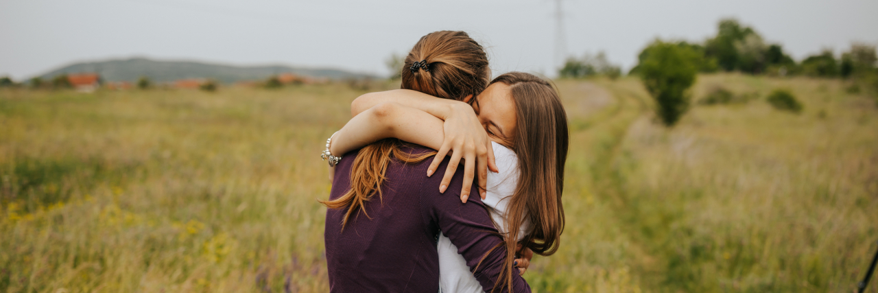 photo of two women hugging
