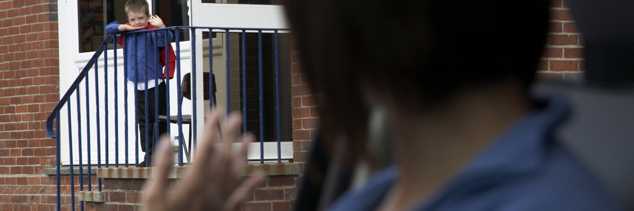 6 Things I Want My Chronically Ill Child's School to Know About My Parenting a mother waving to her son outside of a school