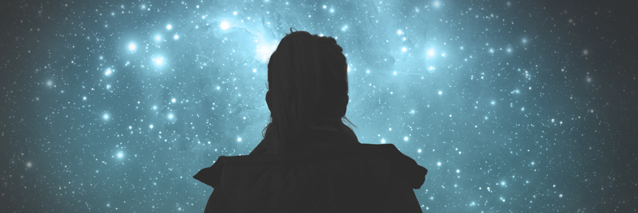 Making a Promise to Self Regarding Mental and Physical Illnesses A photo of a woman from behind at night staring at the stars.